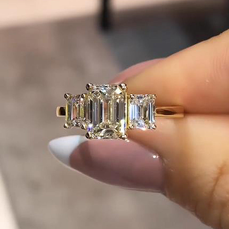 Stunning Golden Tone Emerald Cut Three Stone Engagement Ring In Sterling Silver Juluro